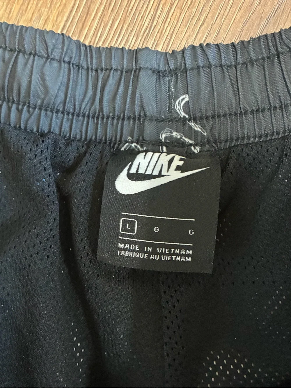 Nike Black Swim Trunks with White Swoosh Print